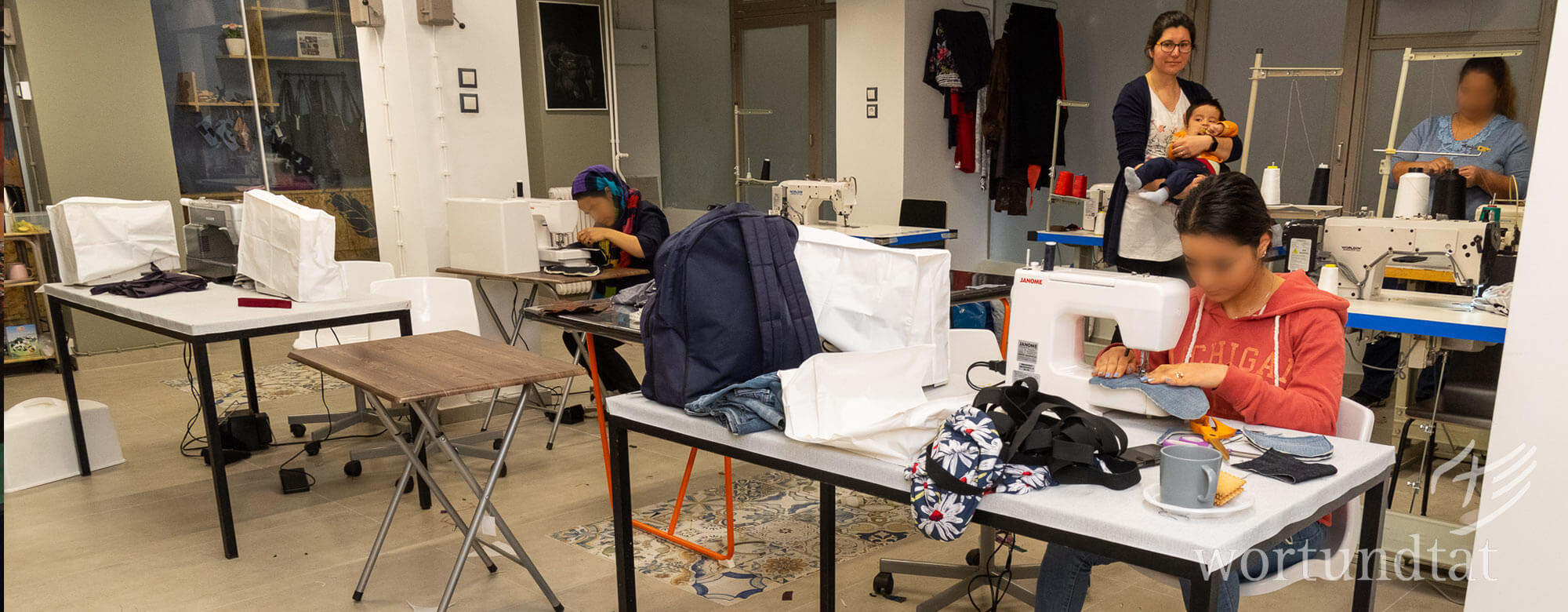 Refugee women learning sewing skills in Athens